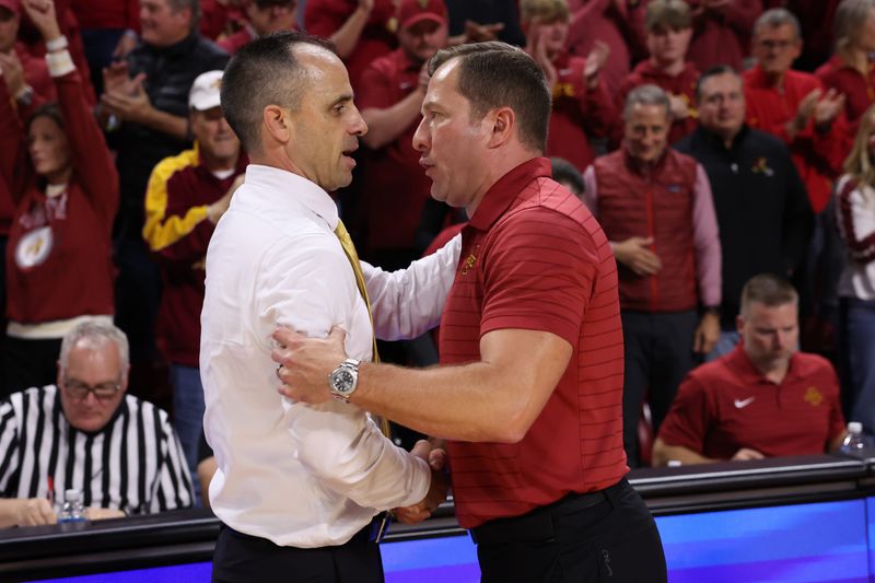 Dec 11, 2025; Ames, Iowa, USA; Iowa State Cyclones head coach T.J. Otzelberger greets Iowa Hawkeyes head coach Ben McCollum after the game at James H. Hilton Coliseum. Mandatory Credit: Reese Strickland-Imagn Images