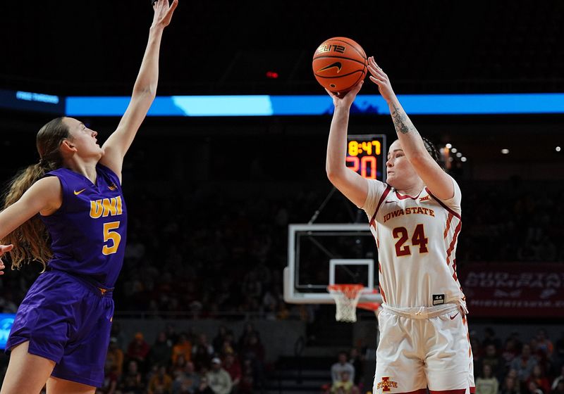 Iowa State Cyclones' forward Addy Brown (24) takes a three-point shot over Norther Iowa Panthers forward Ryley Goebel (5) during the first quarter on December 14, 2025, at Hilton Coliseum in Ames, Iowa.