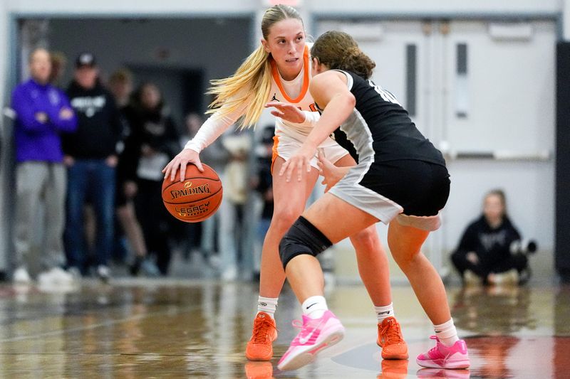 Solon’s Delainey Durr (2) brings the ball down the court against Mount Vernon’s Savanna Wright (10) Dec. 16, 2025 in Solon, Iowa.