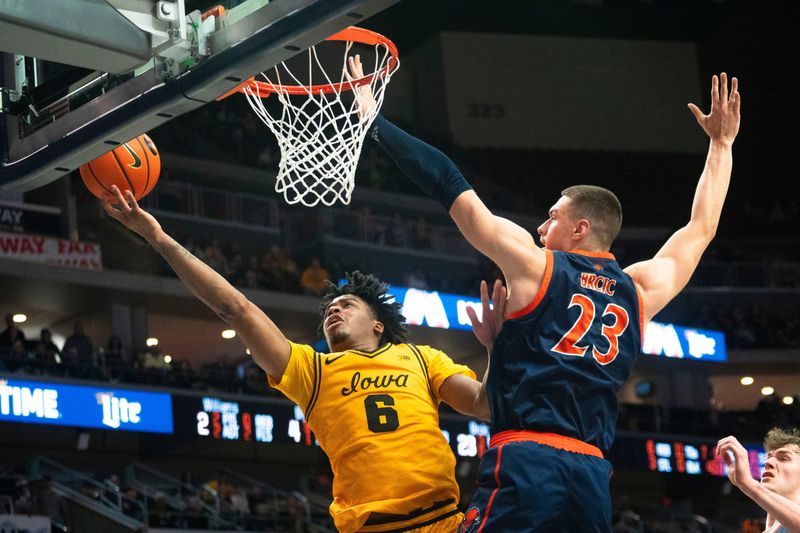 Iowa's Tavion Banks attempts a shot against Bucknell's Grgur Brcic during a game at Casey's Center on Saturday, Dec. 20, 2025 in Des Moines.
