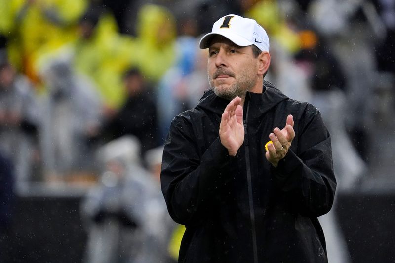Iowa offensive coordinator Tim Lester watches warm ups Nov. 8, 2025 before a Big Ten Football game against the Oregon Ducks at Kinnick Stadium in Iowa City, Iowa.