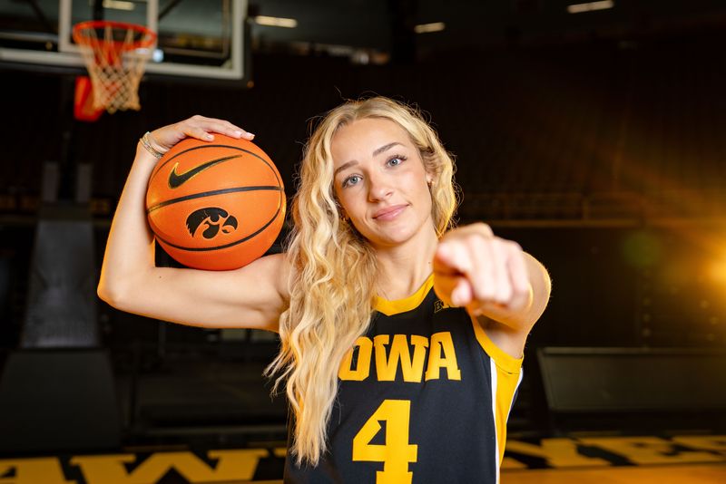 Kylie Feuerbach stands for a photo during Iowa Women's Basketball media day at Carver Hawkeye arena in Iowa City, Oct. 14, 2025.