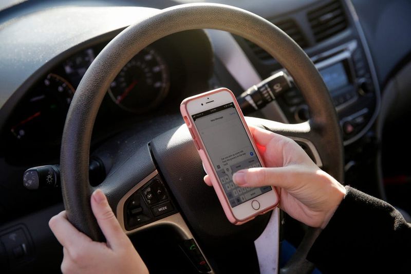 PHOTO ILLUSTRATION -- Starting January 1, 2026, drivers in Iowa will be fined for using their cell phones while driving or while stopped in traffic.