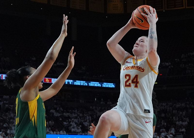 Iowa State Cyclones' forward Addy Brown (24) rebounds the ball around Baylor Bears guard/forward Bella Fontleroy (2) during the second quarter in the Big-12 women’s basketball on Jan. 4, 2026, at Hilton Coliseum in Ames, Iowa.