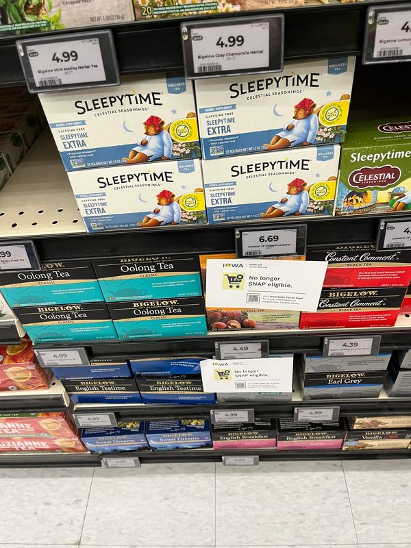 Signs inform Hy-Vee shoppers about changes to the Supplemental Nutrition Assistance Program, known as SNAP, at a store in Des Moines, Sunday, Jan. 4, 2026.