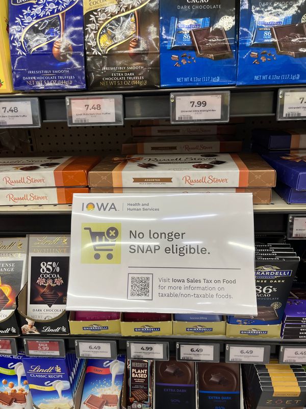 Signs inform Hy-Vee shoppers about changes to the Supplemental Nutrition Assistance Program, known as SNAP, at a store in Des Moines, Sunday, Jan. 4, 2026.