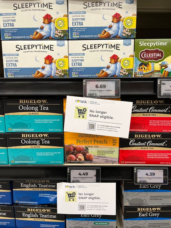 Signs inform Hy-Vee shoppers about changes to the Supplemental Nutrition Assistance Program, known as SNAP, at a store in Des Moines, Sunday, Jan. 4, 2026.