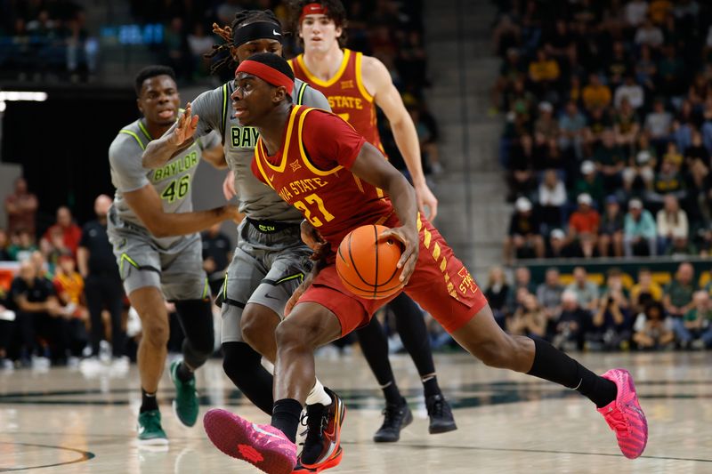 Jan 7, 2026; Waco, Texas, USA; Iowa State Cyclones guard Killyan Toure (27) drives to the basket against Baylor Bears guard Obi Agbim (5) during the first half at Paul and Alejandra Foster Pavilion. Mandatory Credit: Chris Jones-Imagn Images