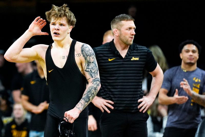Iowa’s Kale Petersen reacts after defeating Wisconsin’s Carson Exferd in a 141-pound match Jan. 9, 2026 at Carver-Hawkeye Arena in Iowa City, Iowa.
