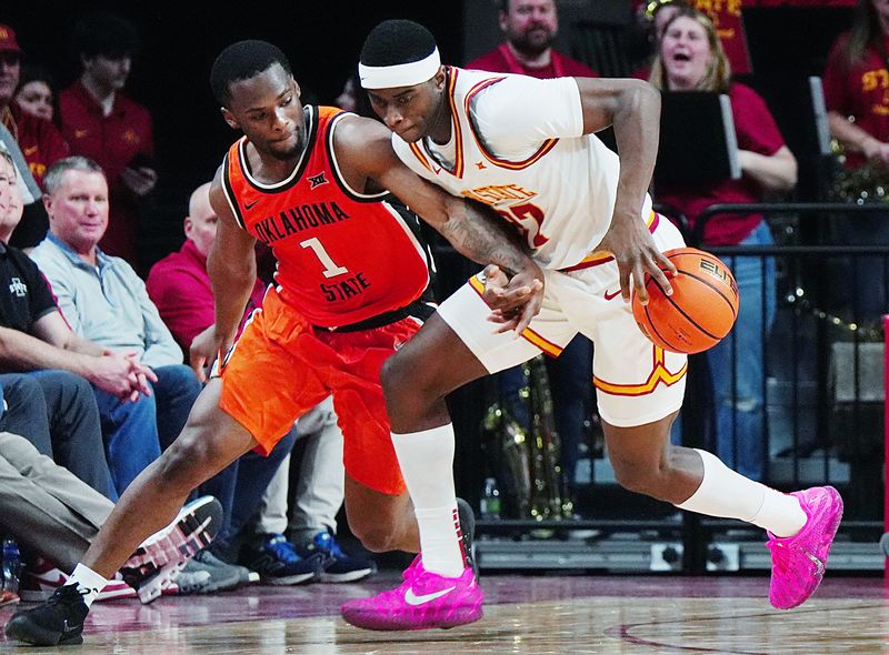 Iowa State Cyclones forward Killyan Toure (27) steals the ball from Oklahoma State Cowboys guard Kanye Clary (1) during the second half in the Big-12 men’s basketball on Jan. 10, 2026, at Hilton Coliseum in Ames, Iowa.