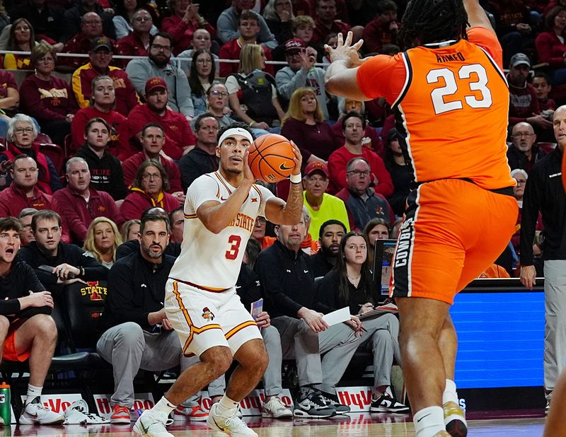 Iowa State Cyclones guard Tamin Lipsey (3) takes a three-point shot over Oklahoma State Cowboys center Benjamin Ahmed (23) during the first half in the Big-12 men’s basketball on Jan. 10, 2026, at Hilton Coliseum in Ames, Iowa.