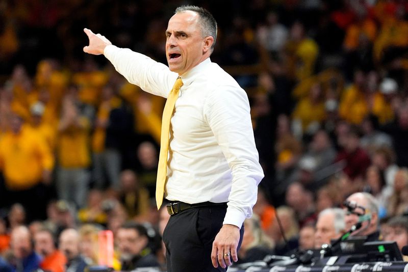 Iowa head coach Ben McCollum reacts during a basketball game against the Illinois Fighting Illini Jan. 11, 2026 at Carver-Hawkeye Arena in Iowa City, Iowa.