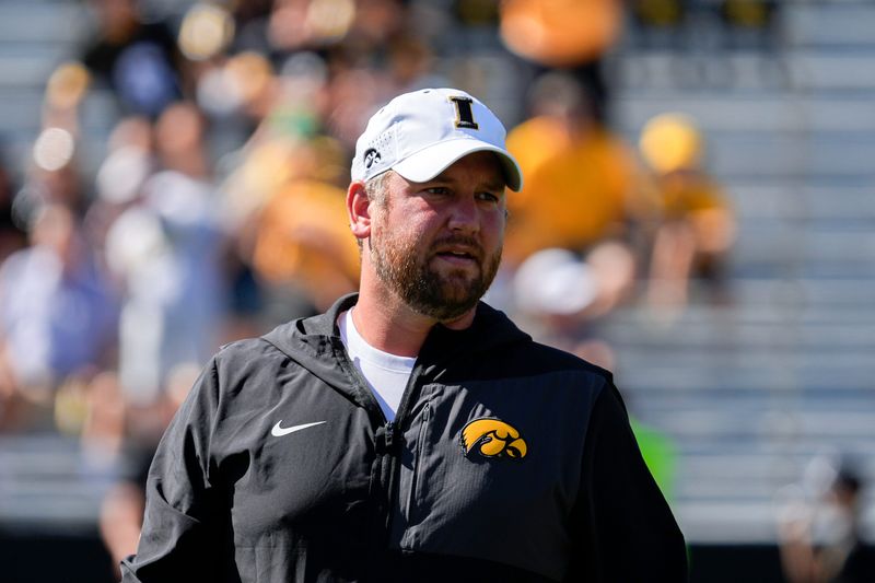 Iowa Hawkeyes Wide Receivers coach Jon Budmayr watches warmups before a football game against the Indiana Hoosiers Sept. 27, 2025 at Kinnick Stadium in Iowa City, Iowa.