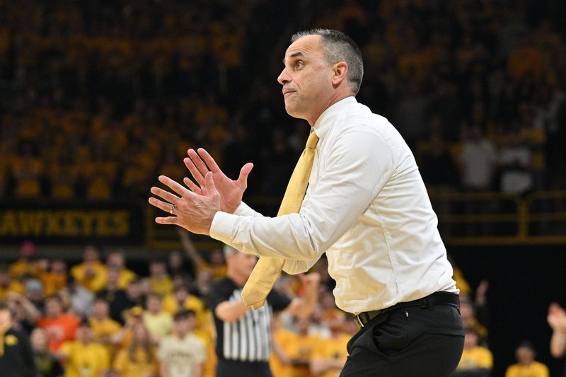 Jan 11, 2026; Iowa City, Iowa, USA; Iowa Hawkeyes head coach Ben McCollum reacts during the second half against the Illinois Fighting Illini at Carver-Hawkeye Arena. Mandatory Credit: Jeffrey Becker-Imagn Images