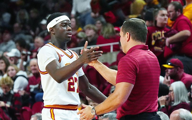 Iowa State Cyclones forward Killyan Toure (27) gets congratulation from men's basketball head coach T.J. Otzelberger during the second half against UCF in the Big-12 conference game on Jan. 20, 2026, at Hilton Coliseum in Ames, Iowa.