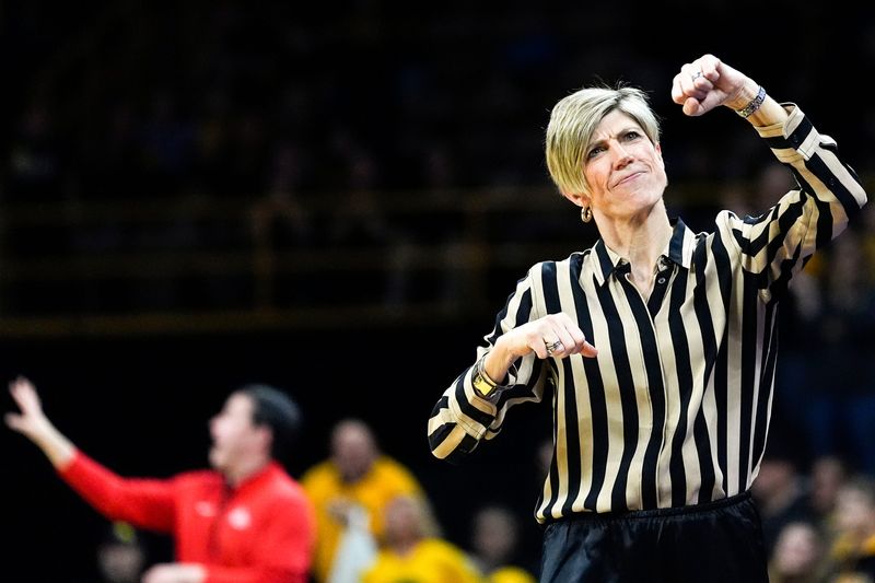 Iowa head coach Jan Jensen fist-pumps toward the end of a basketball game against the Ohio State Buckeyes Jan. 25, 2026 at Carver-Hawkeye Arena in Iowa City, Iowa.