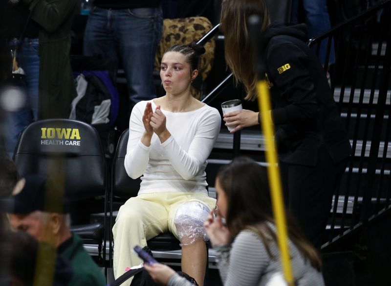 IOWA CITY, IA - JANUARY 25: Guard Taylor McCabe #2 of the Iowa Hawkeyes sits on the bench with ice on her knee after exiting in the first minute of play in the first half against the Ohio State Buckeyes on January 25, 2026 at Carver-Hawkeye Arena, in Iowa City, Iowa. (Photo by Matthew Holst/Getty Images)