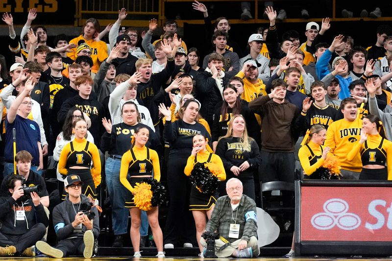 Iowa fans wave goodbye as USC forward Ezra Ausar (2) fouls out of the game against the Iowa Hawkeyes Jan. 28, 2026 at Carver-Hawkeye Arena in Iowa City, Iowa.