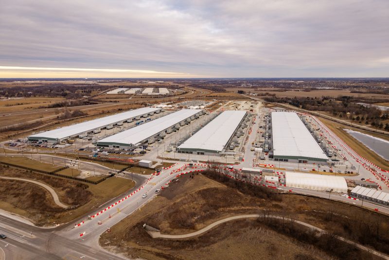 Data centers in West Des Moines are seen from the air, Jan. 28, 2026. Among the burgeoning facilities in the city is one that housed Microsoft's Azure supercomputer, which Open AI used to pioneer its system.