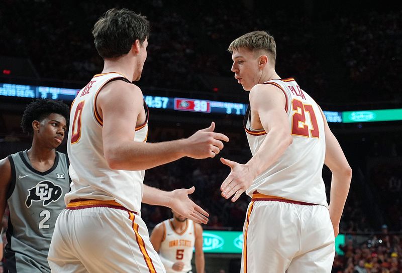 Iowa State Cyclones forward Dominykas Pleta (21) celebrates with guard Nate Heise (0) after a score during the second half in the Big-12 men’s basketball on Jan. 29, 2026, at Hilton Coliseum in Ames, Iowa.