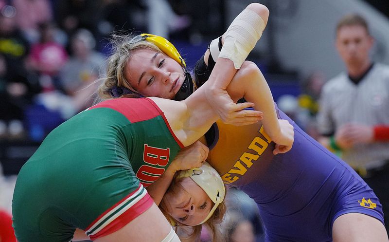 Nevada’s Allison Houston tries to take down Boone’s Poppy Malone in the championship match at 105 pounds during the Class 2A Region 4 girls wrestling tournament on Jan. 30 at the Nevada High School gym in Nevada, Iowa. Houston pinned Malone to claim the regional title and earn her first trip to state.