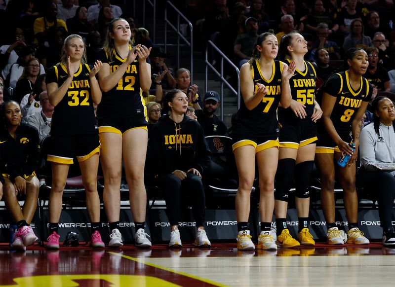 Taylor McCabe, center, made the trip with her teammates to Los Angeles and has been rehabbing her left knee ahead of surgery.