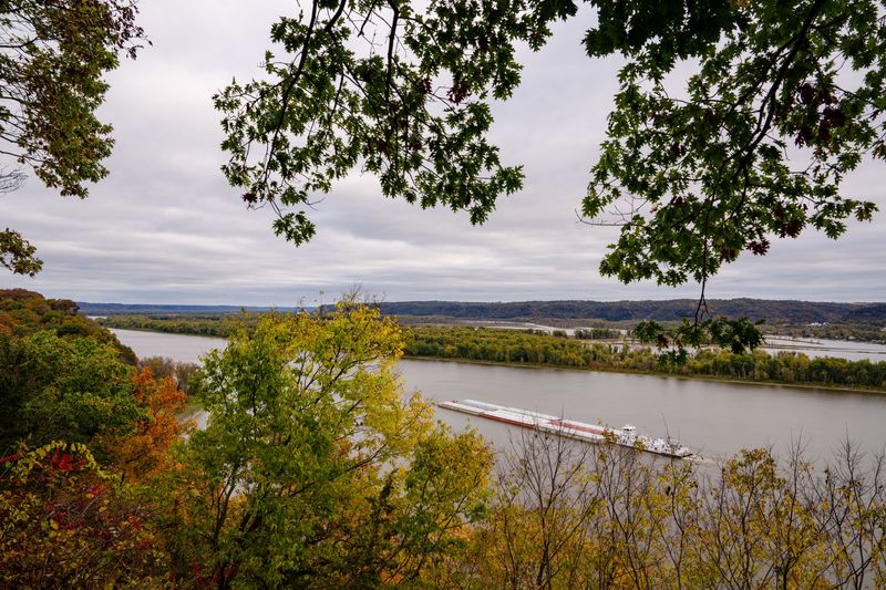 A barge makes its way up the Mississippi River at Effigy Mounds National Monument in Harpers Ferry Iowa, Oct. 22, 2025.