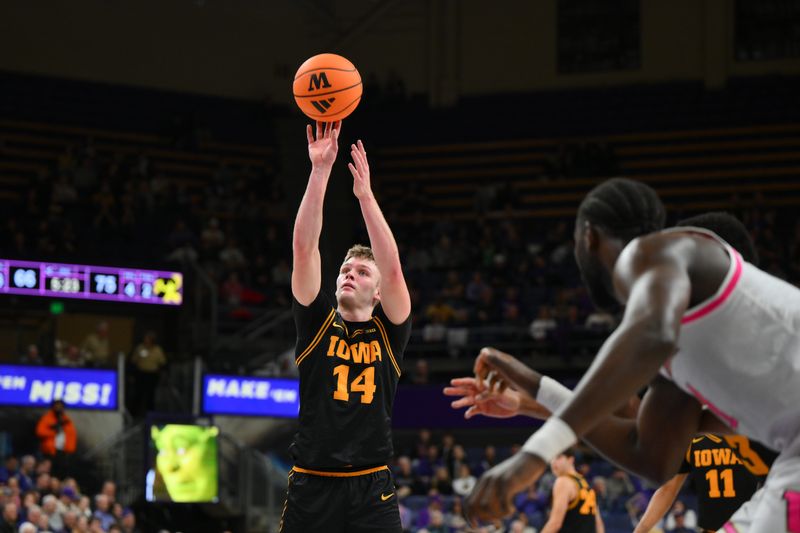Feb 4, 2026; Seattle, Washington, USA; Iowa Hawkeyes guard Bennett Stirtz (14) shoots a free throw during the second half against the Washington Huskies at Alaska Airlines Arena at Hec Edmundson Pavilion. Mandatory Credit: Steven Bisig-Imagn Images