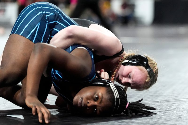 Ames’ Lexa Rozevink wrestles Cedar Rapids Jefferson’s Josephine Budederi in a 135-pound quarterfinal match Feb. 5, 2026 during the IGHSAU State Wrestling Championship at Xtream Arena in Coralville, Iowa.