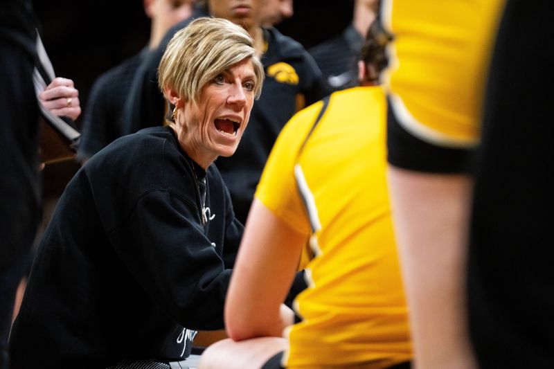 Iowa head coach Jan Jensen talks with her team during a timeout against Minnesota on Feb. 5, 2026, at Carver-Hawkeye Arena.