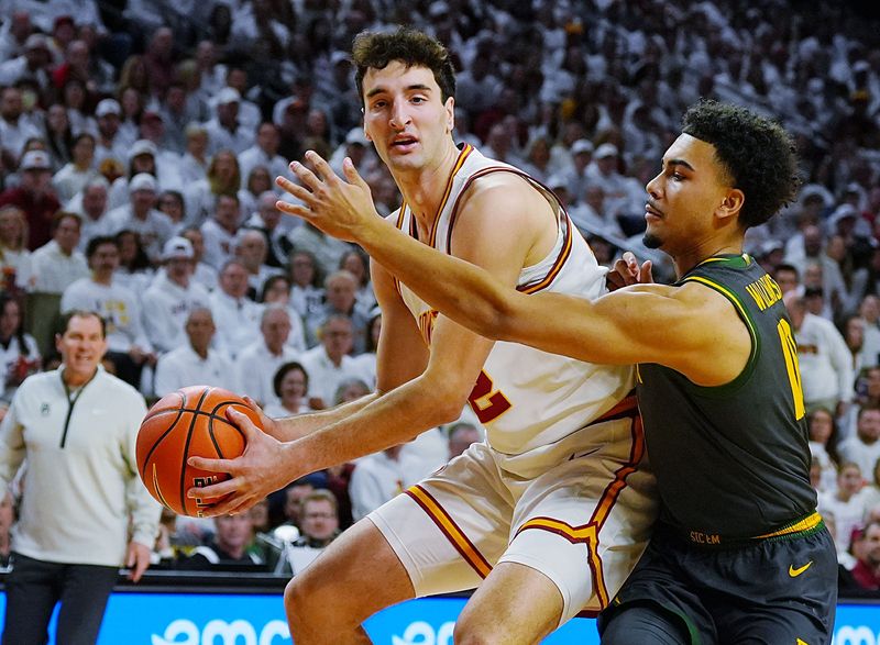Iowa State Cyclones forward Milan Momcilovic (22) drives with the ball asBaylor Bears guard Isaac Williams IV (10) defends during the first half in the Big-12 men’s basketball on Feb. 7, 2026, at Hilton Coliseum in Ames, Iowa