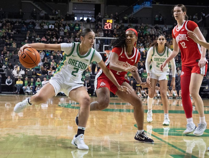 Oregon’s Katie Fiso, left, takes the ball downcourt against Ohio State’s Chance Gray during the first half at Matthew Knight Arena in Eugene Feb. 8, 2026.