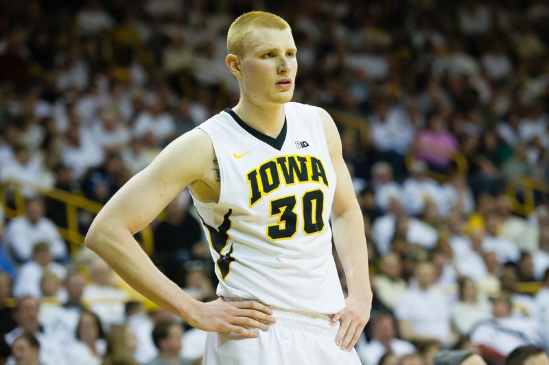 Feb 12, 2015; Iowa City, IA, USA; Iowa Hawkeyes forward Aaron White (30) watches action against the Minnesota Golden Gophers at Carver-Hawkeye Arena. Minnesota defeated Iowa 64-59. Mandatory Credit: Steven Branscombe-USA TODAY Sports