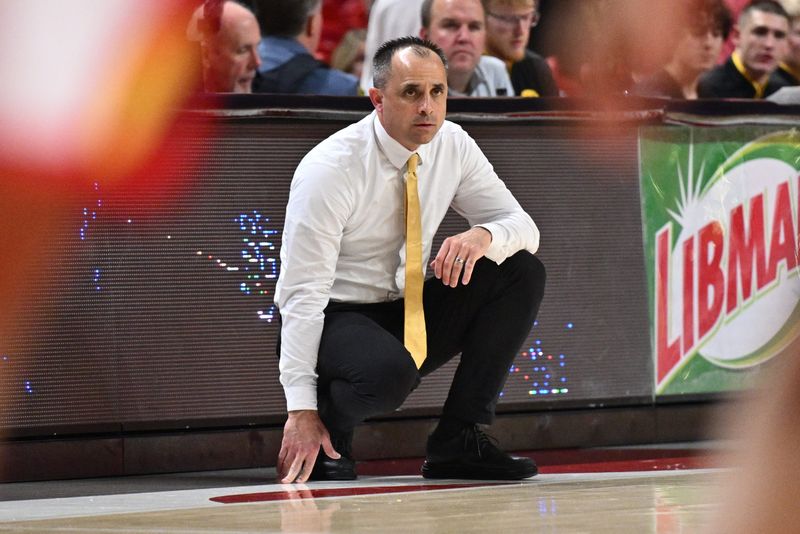 Feb 11, 2026; College Park, Maryland, USA; Iowa Hawkeyes head coach Ben McCollum watches his team play against the Maryland Terrapins in the second half at Xfinity Center. Mandatory Credit: Jamie Sabau-Imagn Images