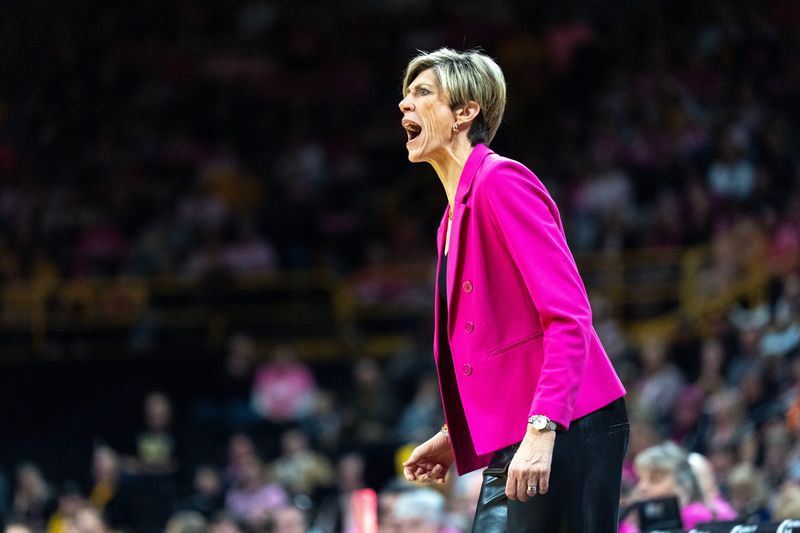 Iowa head coach Jan Jensen reacts during a basketball game against the Washington Huskies Feb. 11, 2026 at Carver-Hawkeye Arena in Iowa City, Iowa.