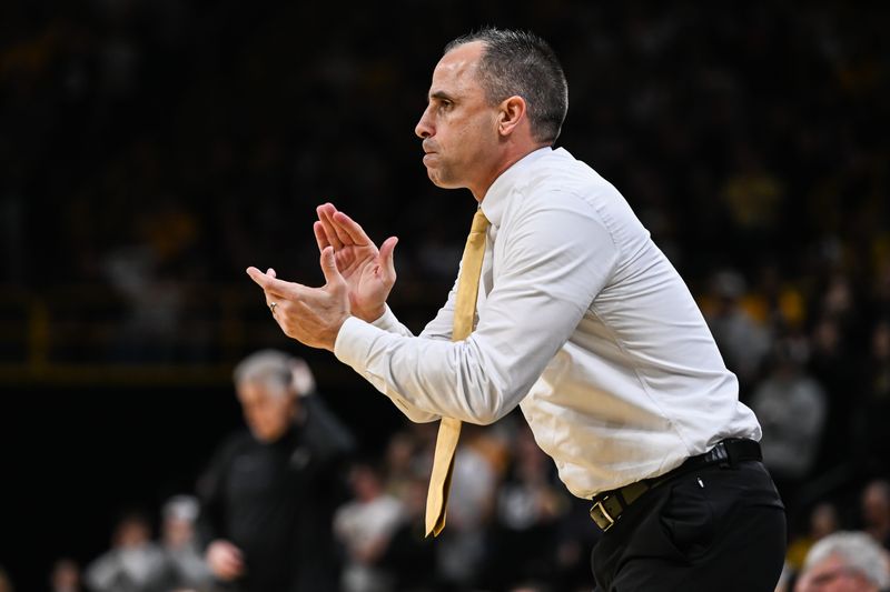 Feb 14, 2026; Iowa City, Iowa, USA; Iowa Hawkeyes head coach Ben McCollum reacts during the first half against the Purdue Boilermakers at Carver-Hawkeye Arena. Mandatory Credit: Jeffrey Becker-Imagn Images