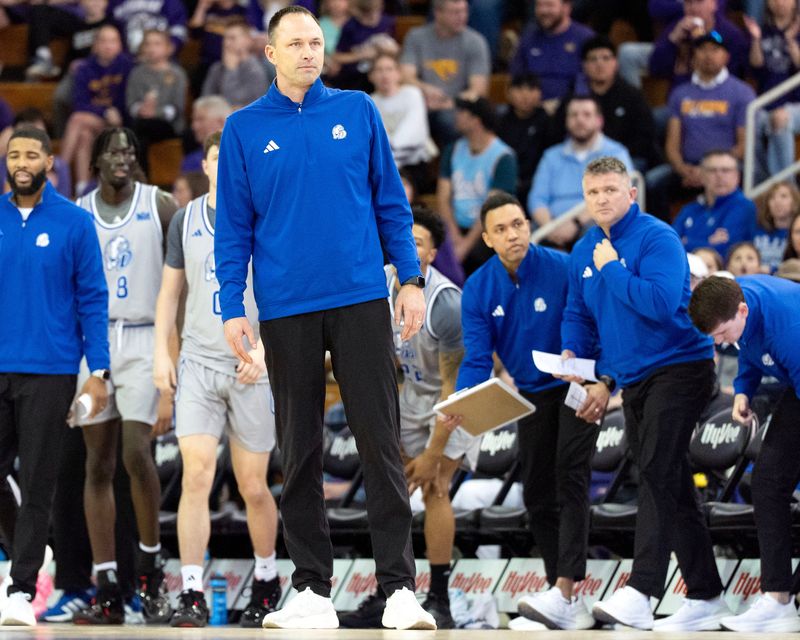 Drake head coach Eric Henderson surveys the court heading into a timeout during a basketball game against the UNI Panthers Feb. 15, 2026 at the McLeod Center in Cedar Falls, Iowa.