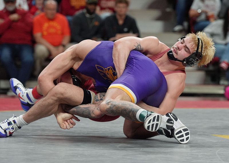 Iowa State wrestler MJ Gaitan takes down UNI's Jared Simma during a match in Feb. The pair of wrestlers will compete at the Big 12 Championships this weekend in Tulsa.
