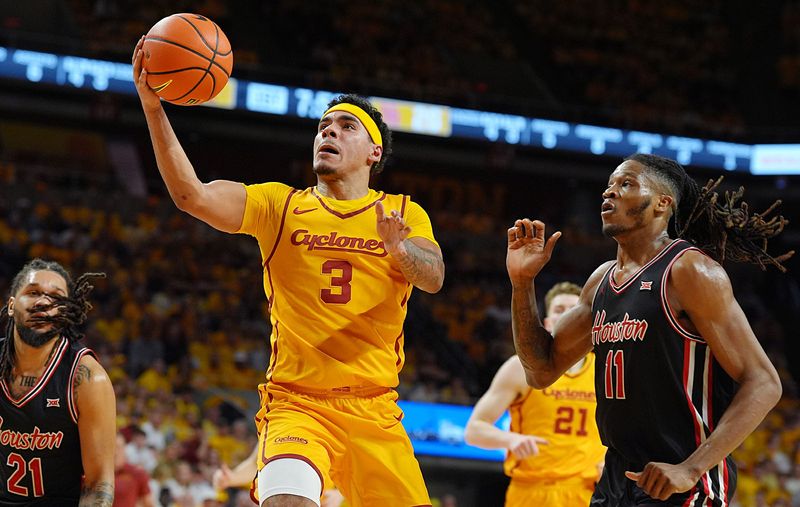 Iowa State Cyclones guard Tamin Lipsey (3) goes for a layup around Houston Cougars forward Joseph Tugler (11) during the first half in the3 Big-12 men’s basketball at Hilton Coliseum on Feb. 16, 2026, in Ames, Iowa