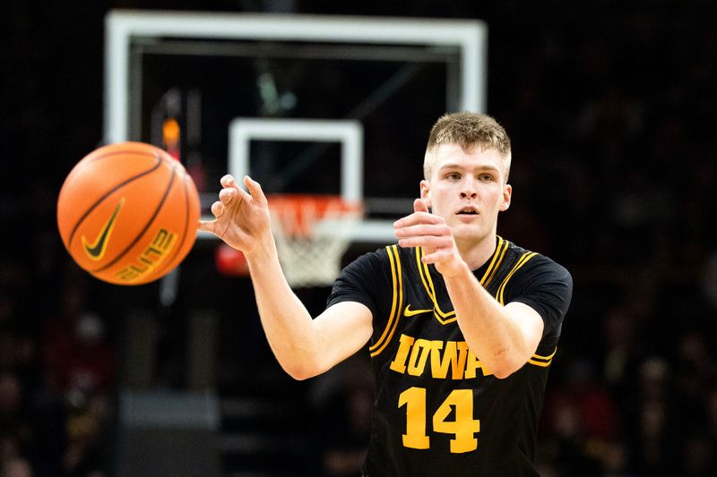 Iowa guard Bennett Stirtz (14) passes the basketball during a Big Ten game against the Nebraska Cornhuskers Feb. 17, 2026 at Carver-Hawkeye Arena in Iowa City, Iowa.