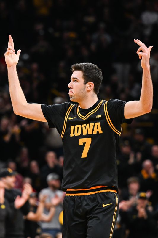 `Feb 17, 2026; Iowa City, Iowa, USA; Iowa Hawkeyes forward Alvaro Folgueiras (7) reacts during the first half against the Nebraska Cornhuskers at Carver-Hawkeye Arena. Mandatory Credit: Jeffrey Becker-Imagn Images
