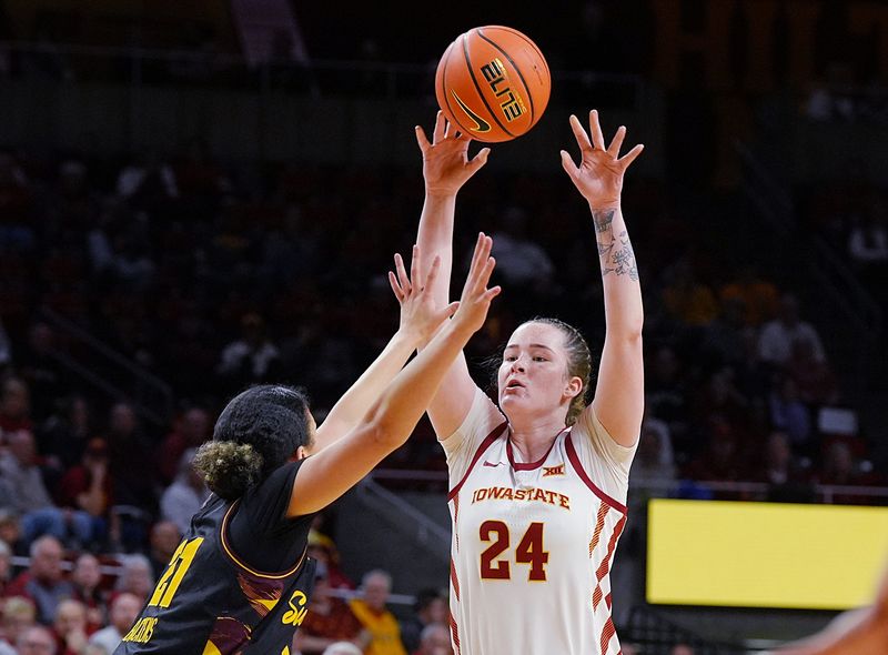 Iowa State Cyclones' forward Addy Brown (24) passes the ball over Arizona State Sun Devils guard Marley Washenitz (11) during the first quarter in the Big-12 women’s basketball at Hilton Coliseum on Feb. 18, 2026, in Ames, Iowa