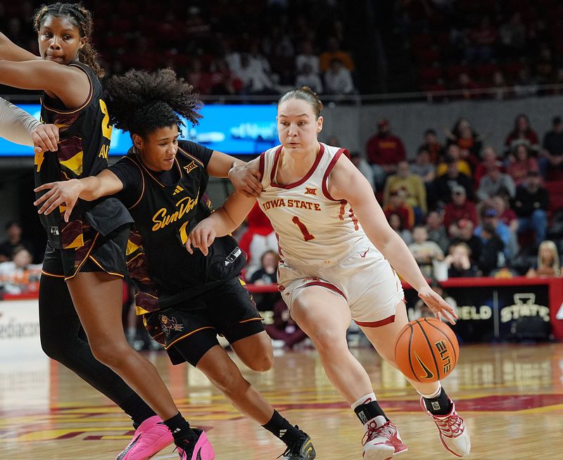 Iowa State Cyclones' guard Reese Beaty (1) drives with the ball to the basket Arizona State Sun Devils guard Amaya Williams (1) during the second quarter in the Big-12 women’s basketball at Hilton Coliseum on Feb. 18, 2026, in Ames, Iowa
