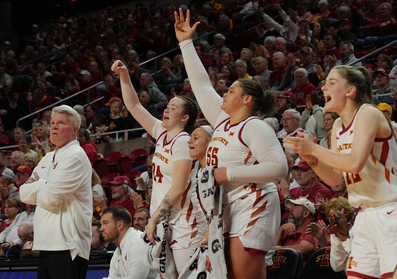 Iowa State Cyclones' forward Addy Brown (24), guard Arianna Jackson (2) center Audi Crooks (55), and guard Kenzie Hare (12) celebrate as head coach Bill Fennelly watches from the bench during the fourth quarter in the Big-12 women’s basketball at Hilton Coliseum on Feb. 18, 2026, in Ames, Iowa