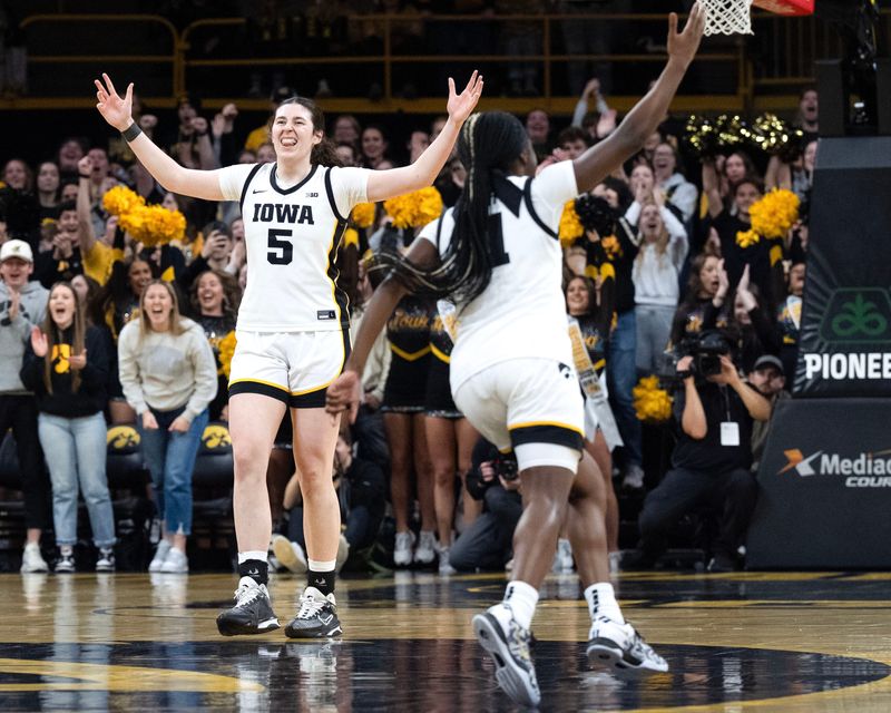 Iowa center Ava Heiden (5) and Iowa guard Chit-Chat Wright (11) react during a game against the Michigan Wolverines Feb. 22, 2026 at Carver-Hawkeye Arena in Iowa City, Iowa.