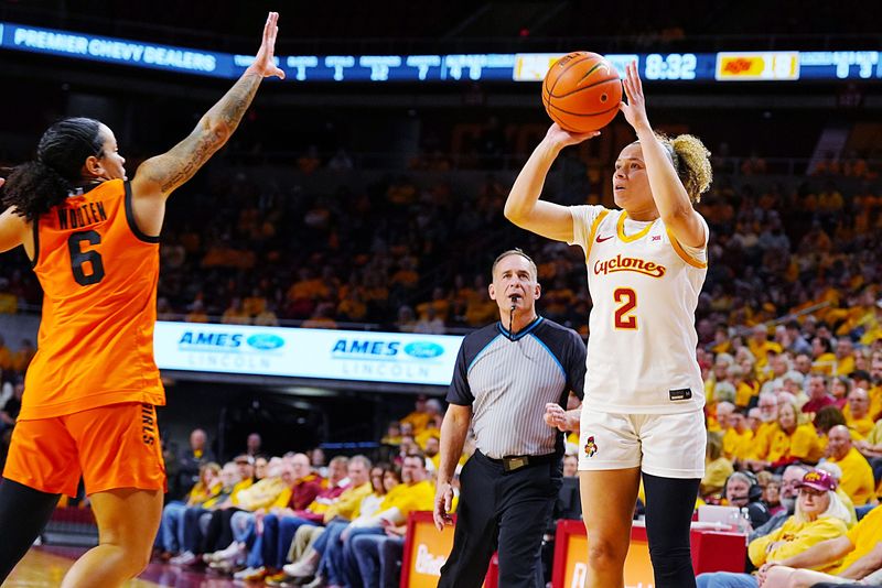 Iowa State Cyclones' guard Arianna Jackson (2) takes a three-point shot over Oklahoma State Cowgirls guard Jadyn Wooten (6) during the second quarter in the senior day women basketball at Hilton Coliseum on February. 25, 2026, in Ames, Iowa.