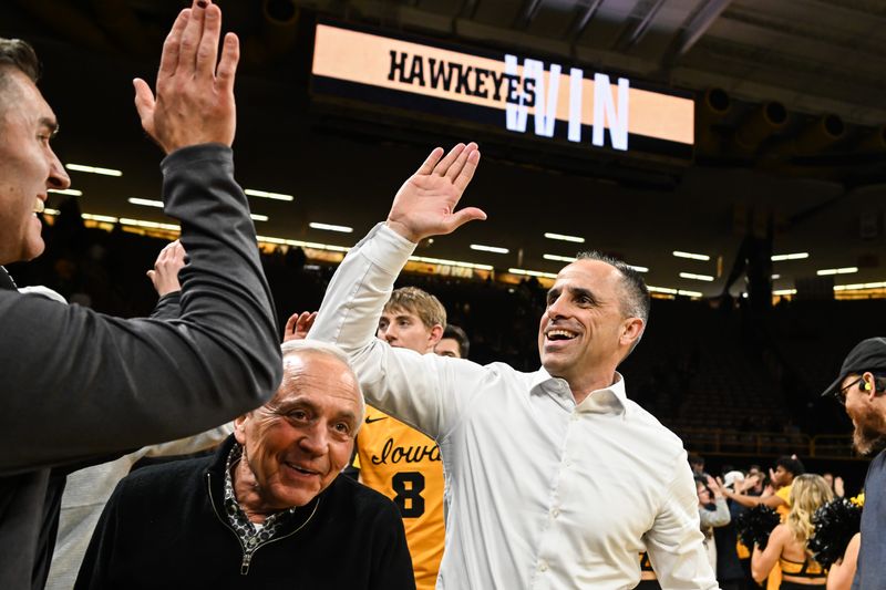 Feb 25, 2026; Iowa City, Iowa, USA; Iowa Hawkeyes head coach Ben McCollum reacts with fans after the game against the Ohio State Buckeyes at Carver-Hawkeye Arena. Mandatory Credit: Jeffrey Becker-Imagn Images