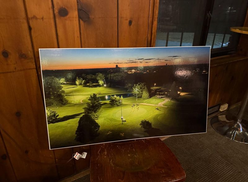 A rendering displayed at an open house Thursday, Feb. 26, 2026, shows what lights at Waveland Golf Course would look like in a plan for night golfing on the front nine holes at the course, 4200 University Ave.
