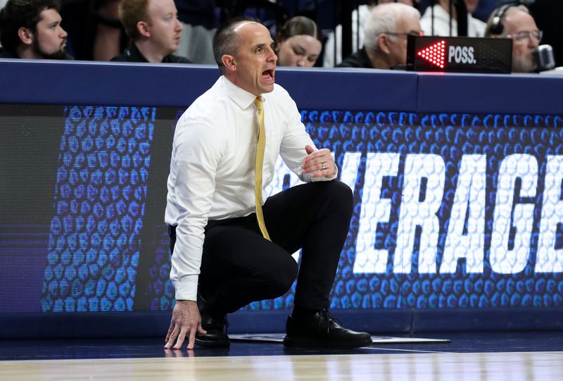 Feb 28, 2026; University Park, Pennsylvania, USA; Iowa Hawkeyes head coach Ben McCollum looks on from the bench during the first half against the Penn State Nittany Lions at Bryce Jordan Center. Mandatory Credit: Matthew O'Haren-Imagn Images