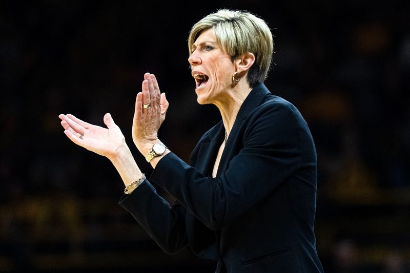 Iowa head coach Jan Jensen reacts during a basketball game against the Illinois Fighting Illini Feb. 26, 2026 at Carver-Hawkeye Arena in Iowa City, Iowa.